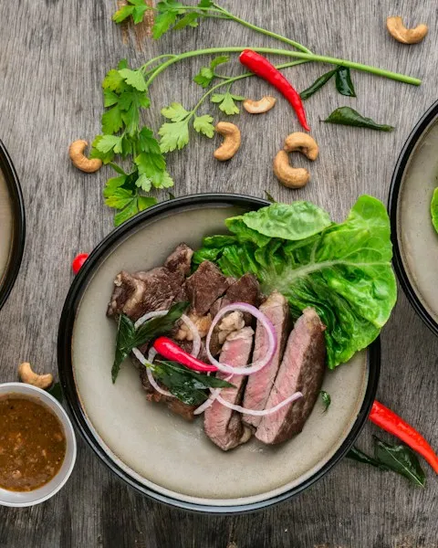 Seared beef with greens and a dipping sauce