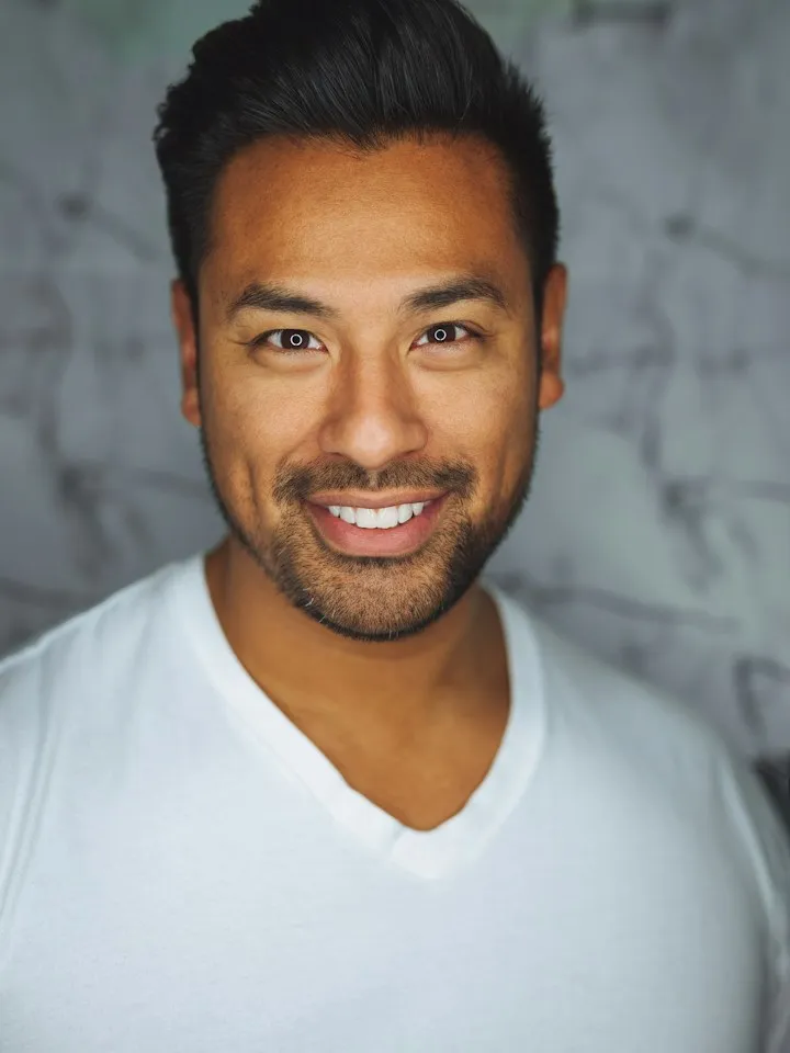 Portrait of a smiling man in a white t-shirt