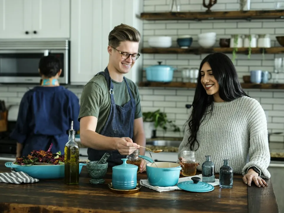 Cook preparing fresh ingredients at a kitchen counter