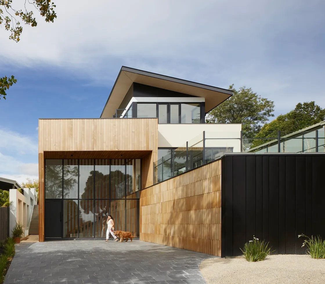 Contemporary home exterior with clean lines and warm landscaping